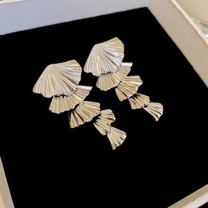 Minimalist silver fan-shaped dangle earrings in a luxury black velvet jewelry gift box