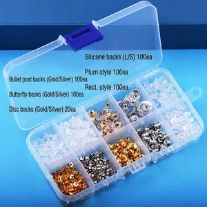 Macro shot of 10-compartment storage box filled with assorted silicone and metal earring backs
