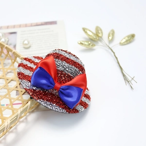 Detail of glitter mini top hat with red and blue satin bow for Independence Day party hair clip