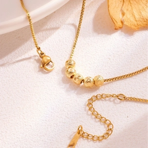 Vintage gold box chain necklace with five frosted lucky beads and lobster clasp