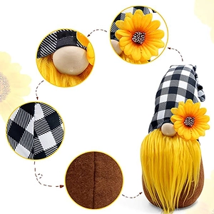 Plush gnome doll with black and white checkered hat and yellow sunflower detail