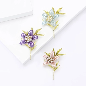Elegant enamel lily flower brooches with pearls and crystals in pink, blue, and purple
