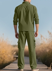 Outdoor shot of olive green corduroy tracksuit set with textured fabric for men