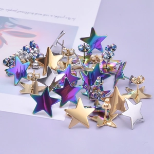 Detailed pile of star-shaped stainless steel earrings in gold, silver and rainbow finish