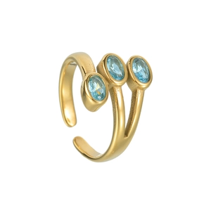 Detail of gold split-band ring featuring three light blue oval zircons in a tiered setting