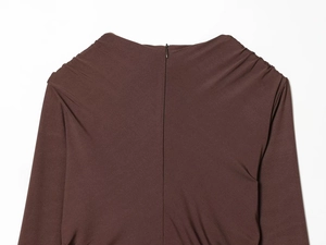 Detail of deep brown knit dress with invisible back zipper and ruched shoulder seams