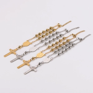 Set of four stainless steel rosary bracelets with cross pendants and religious medals