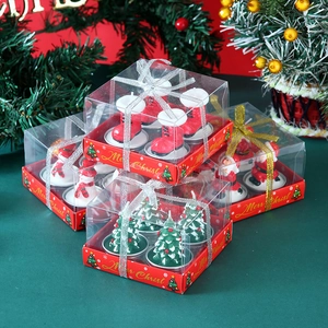 Detailed view of Christmas candle gift set featuring Santa, snowman, and tree shapes