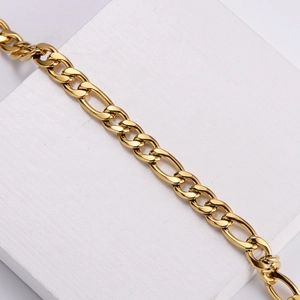 Detailed view of 7mm 18k gold plated stainless steel Figaro chain on a white display