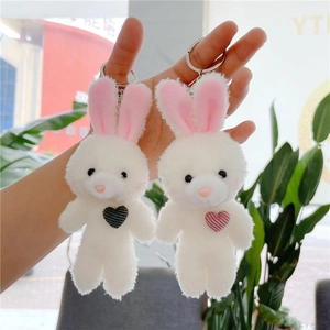 Cute plush rabbit keychains with pink ears and heart detail, fluffy bag accessories