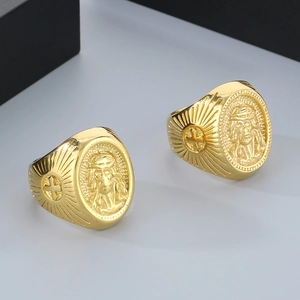 Macro detail of 18k gold plated stainless steel Jesus relief and cross engraving on ring