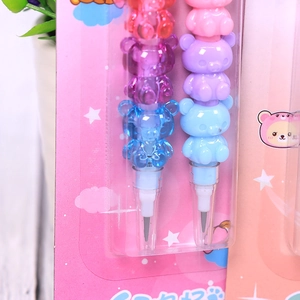 Close-up of colorful stackable cartoon bear pencil with interchangeable plastic sections