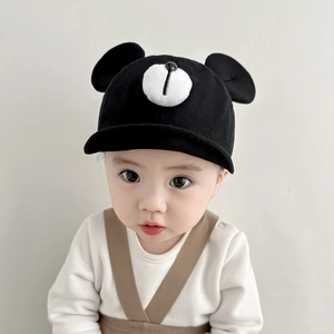 Detail view of baby bear baseball cap in black with 3D ears and cute nose design