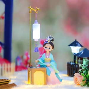 Detail of ancient Chinese style girl figurine with warm LED lantern and resin base
