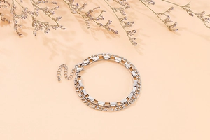Detail of silver double-layered chain bracelet with lobster clasp and extension chain