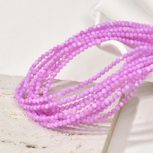 Detailed view of 3mm pink-purple natural freshwater shell beads for DIY jewelry making
