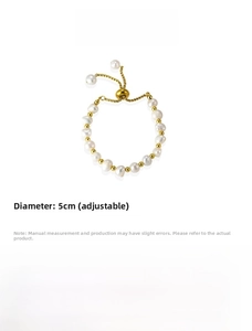 Detailed view of adjustable freshwater pearl bracelet with gold titanium steel accents