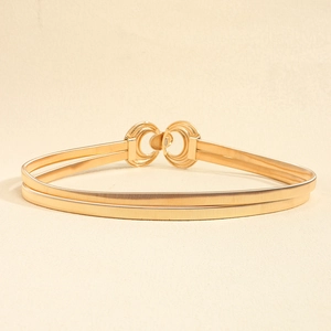 Detailed close-up of double-layer gold spring chain belt with interlocking round buckles