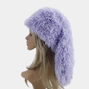 Detail view of purple fluffy faux fur trapper hat with long rabbit ears on mannequin