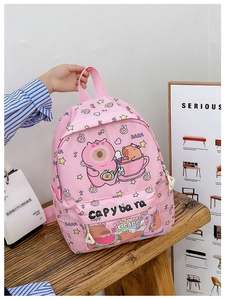 Detailed view of pink capybara printed backpack with durable zippers and side pockets
