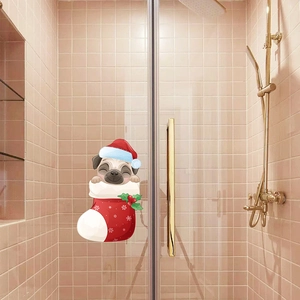 Close-up of a Christmas pug sticker in a red stocking on a glass shower door