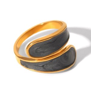 Macro detail of gold-plated stainless steel ring with dark grey resin inlay and sparkle finish