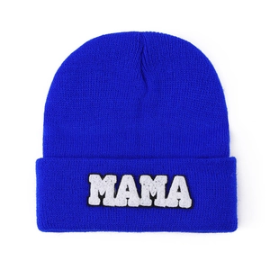 Detail of royal blue knit beanie featuring high-quality white MAMA towel embroidery