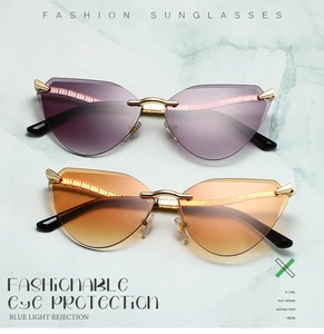 Detail of rimless cat-eye sunglasses with gradient lenses and textured metal edges