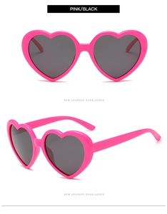 Front and side views of heart-shaped sunglasses in vibrant pink with dark lenses