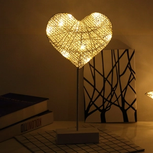 Handmade woven heart LED table lamp with warm glow and wooden base for home decor