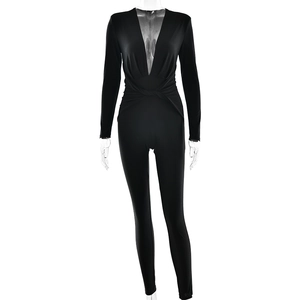 Slim fit black long sleeve bodysuit with deep V-neck and twist detail on plain background