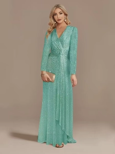 Detail of sequined long sleeve V-neck evening gown with waist knot in mint green