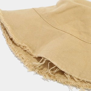 Detail of a khaki frayed edge bucket hat made of soft washed cotton fabric for outdoors