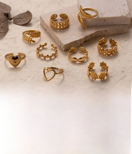 Detailed set of 10 gold titanium steel adjustable rings featuring heart and leaf designs