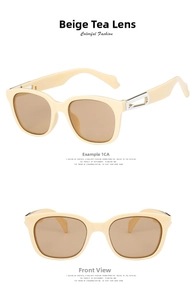 Detail view of beige square sunglasses with silver metal hinges and brown tinted lenses