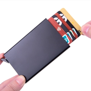 Detail shot of black RFID blocking slim card wallet showing automatic pop-up mechanism