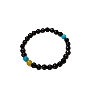 Aquamarine agate beaded bracelet with polished black stones and geometric blue accents