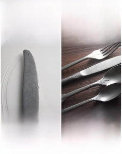 Detailed relief pattern on vintage matte stainless steel cutlery handle with embossed carving
