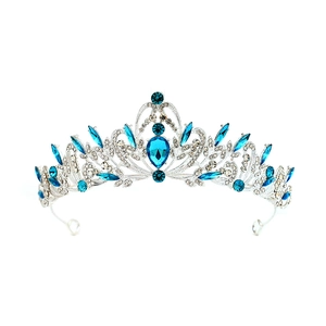 Macro detail of silver bridal crown with deep blue teardrop stones and marquise crystals