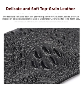 Macro shot of crocodile embossed texture on top grain cowhide leather men's clutch