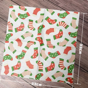Christmas stocking printed paper napkins for parties, size 33cm x 33cm on dark wood background