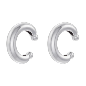 Macro detail of polished silver C-shaped ear cuffs with small decorative round beads