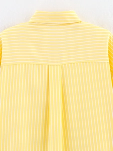 Detail of the back yoke stitching on this yellow and white striped cotton-blend shirt