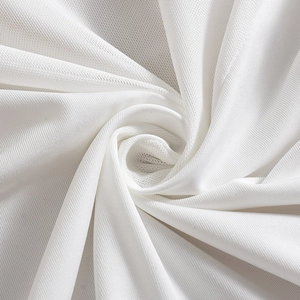 Macro view of white mesh fabric texture with breathable micro-pore structure for dresses