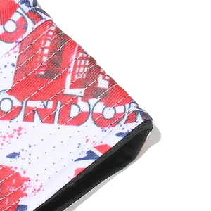 Close-up of London theme print on knit fabric featuring phone booth and text detail