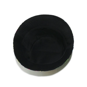 Internal view of black bucket hat showing brim detail with colorful pattern and stitching