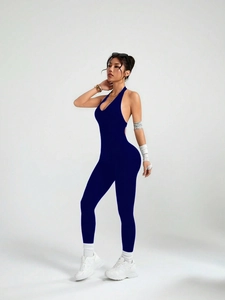 Detailed back view of a navy blue seamless backless halter yoga jumpsuit for women