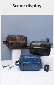 Three premium waterproof PU leather toiletry bags in brown, black and navy for business travel