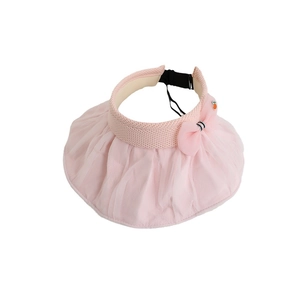 Pink sun visor hat for girls with mesh bow and carrot accent on a knit headband