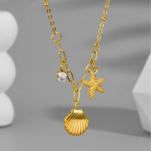 18k gold plated stainless steel starfish and seashell necklace with a sparkling zircon